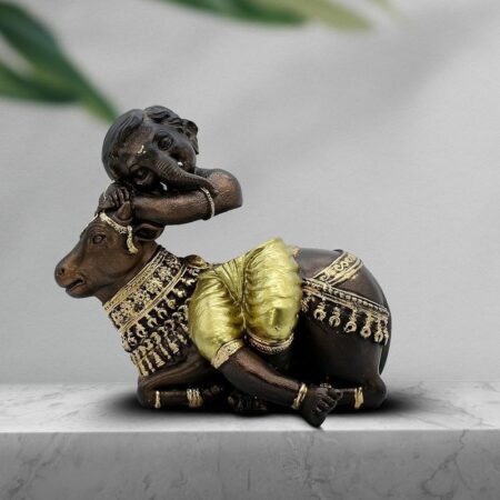 Baby Ganesha Idol Resting on Cow Antique Finish Polyresin Ganpati Murti with Golden Dhoti for Home Decor, Pooja Room Gift, Inch
